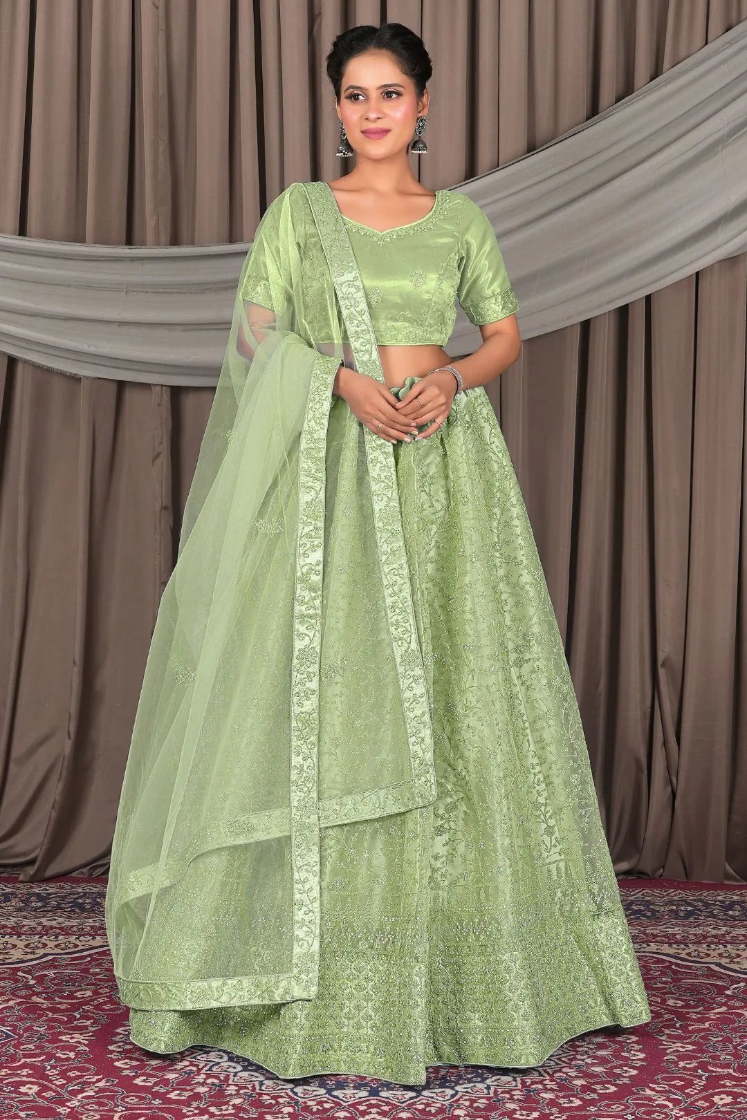 Pista Designer Net Lehenga Choli For Weddings - Gajiwala